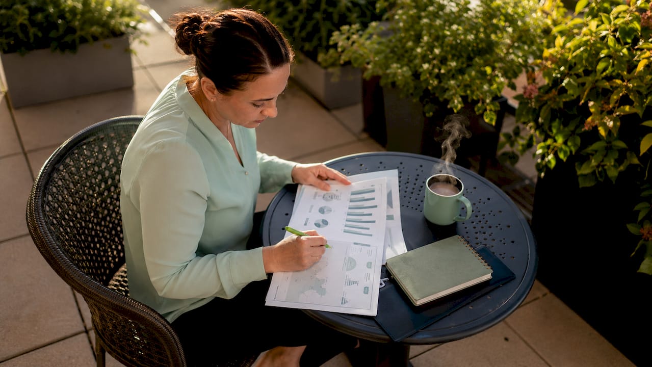 Healthcare manager reviewing intake volume reports